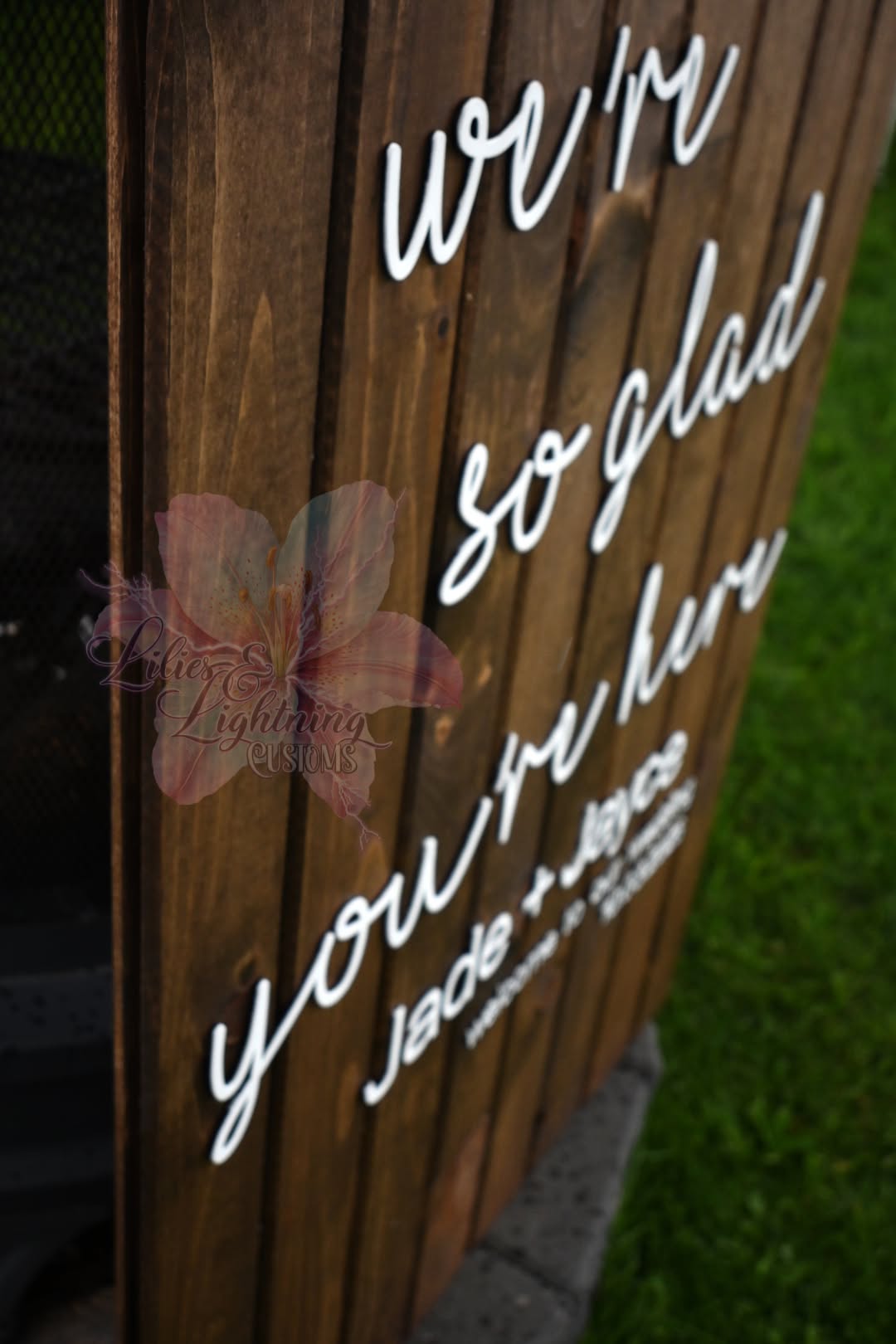 Custom wooden wedding sign with personalized layered lettering and stained background for ceremony decor